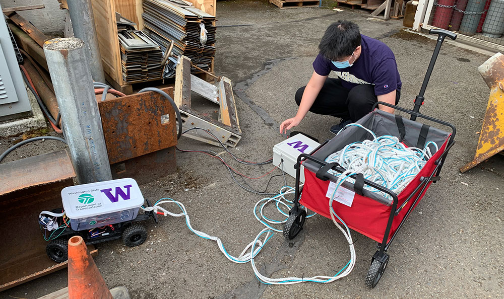 A student testing a rover