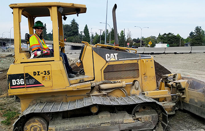 student operating a bulldozer