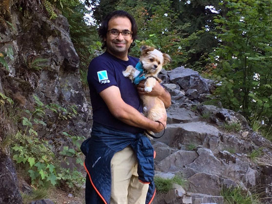 Kumar holding a dog