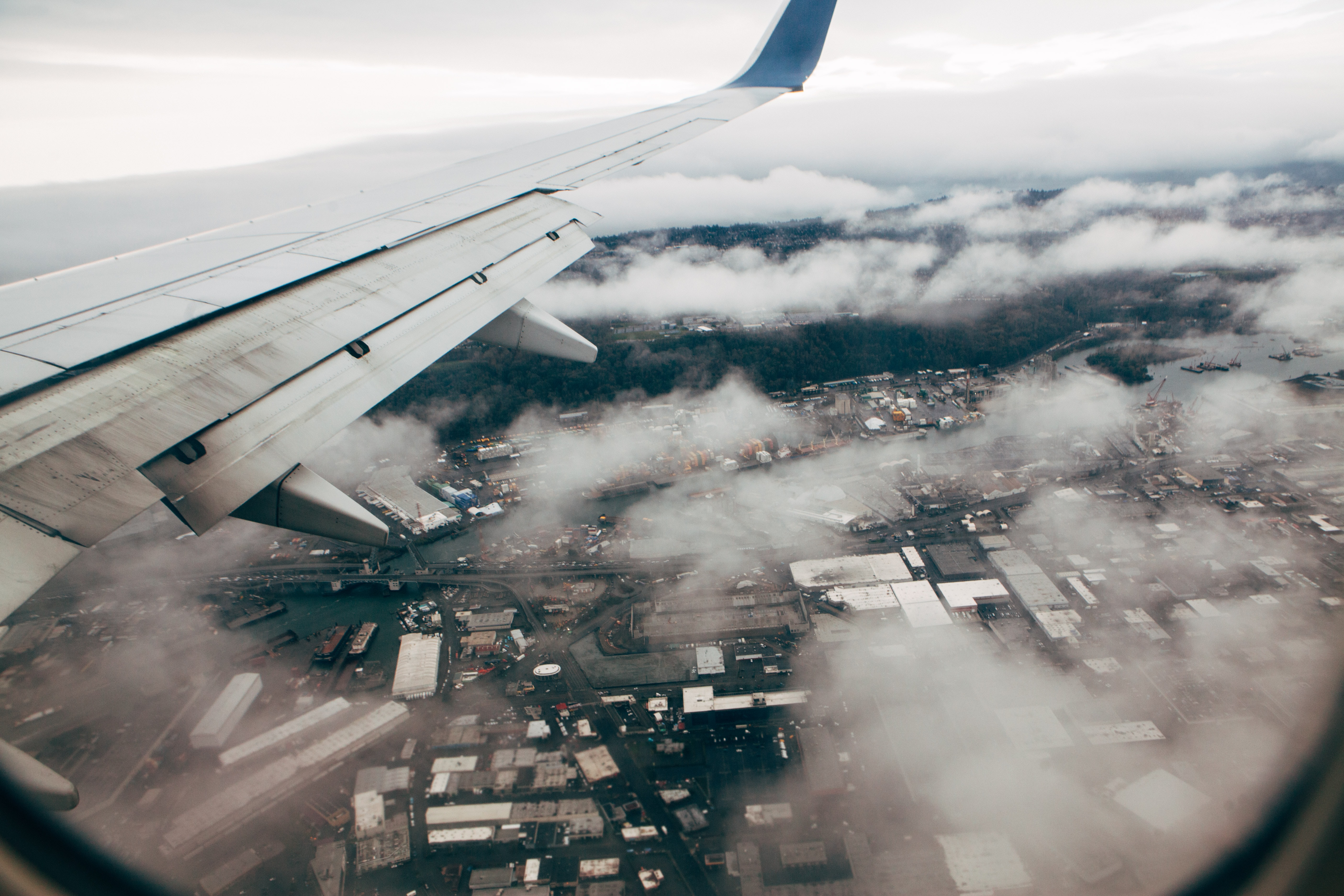 airplane flying over a city