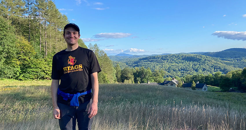 Dan McCabe standing in a grassy field