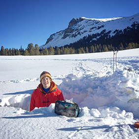 researcher in chest deep snow