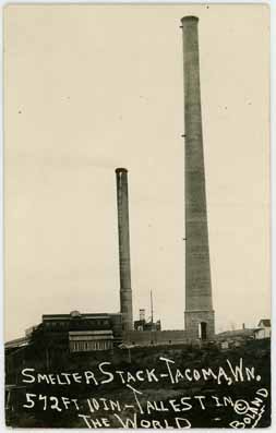 a historical photo showing 2 smokestacks