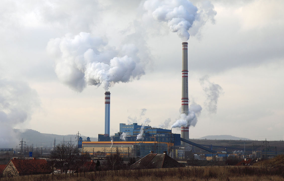 smoke rising from two chimneys