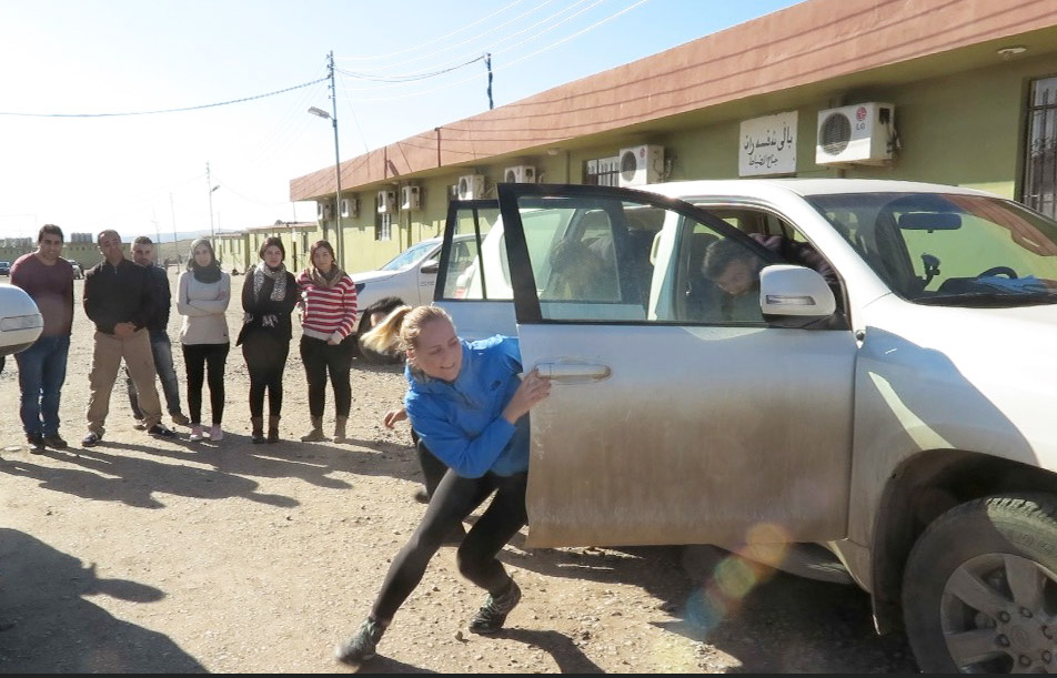 photo of Alumna Heta Kosonen practicing evacuating from car to car