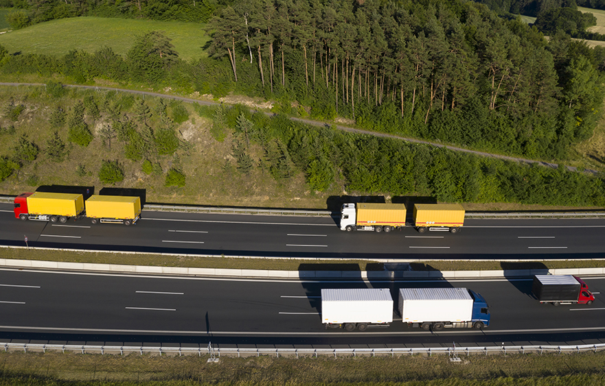 a computer rendering of trucks on a highway
