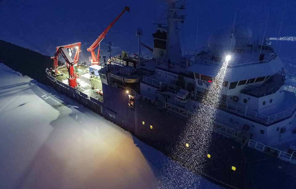 Icebreaker breaking a path through sea ice