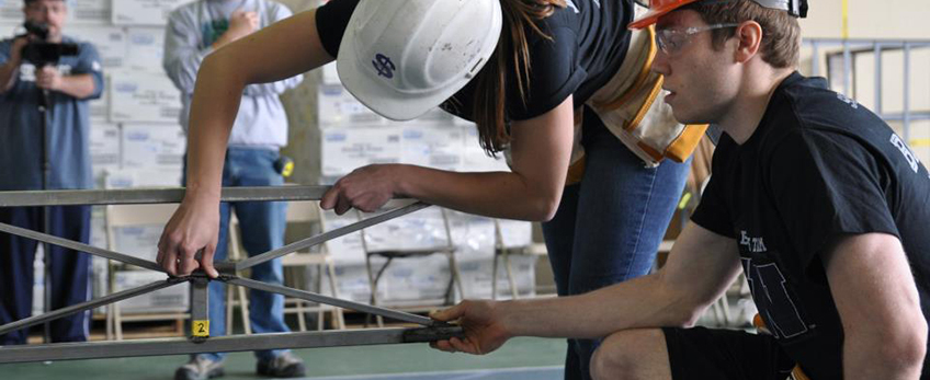 students working on steel bridge