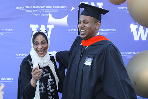 a graduate with his family member