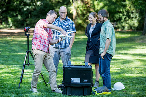 A group of faculty conducting research