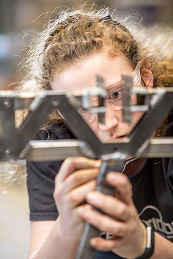 Martha Quigg works on the steel bridge