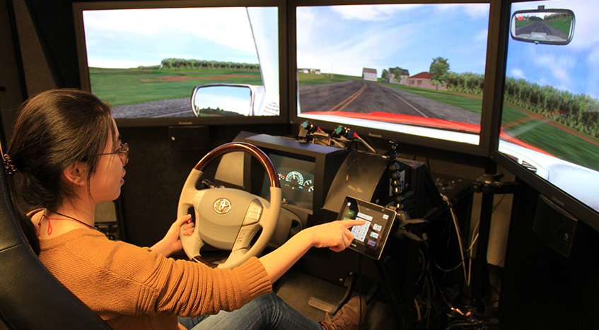 Graduate students perform a simulator study in the Human Factors and Statistical Modeling Lab.