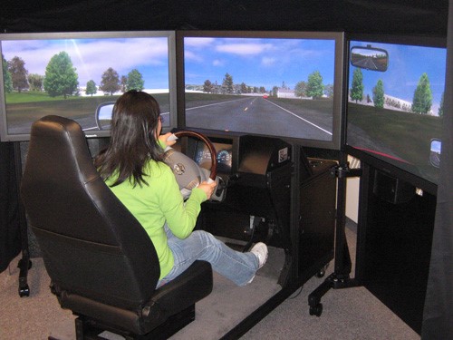 person in driving simulator