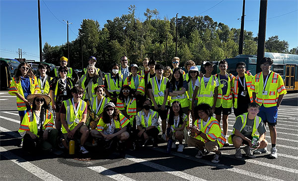 A group of students in safety vests