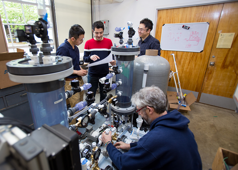 Students and employees connecting various components of the pilot system