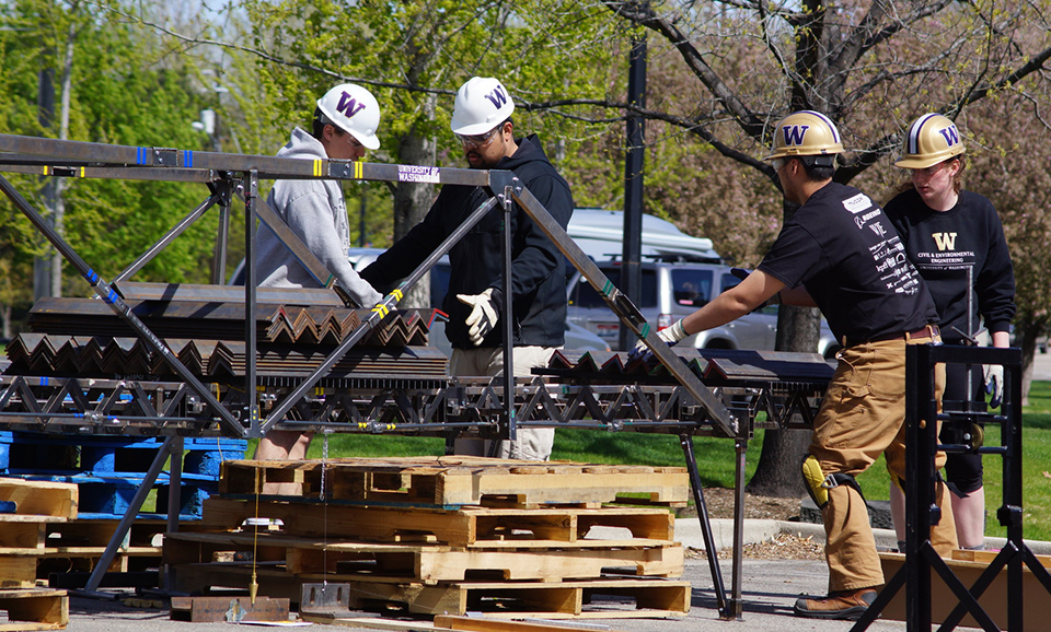 The build team applies steel angles