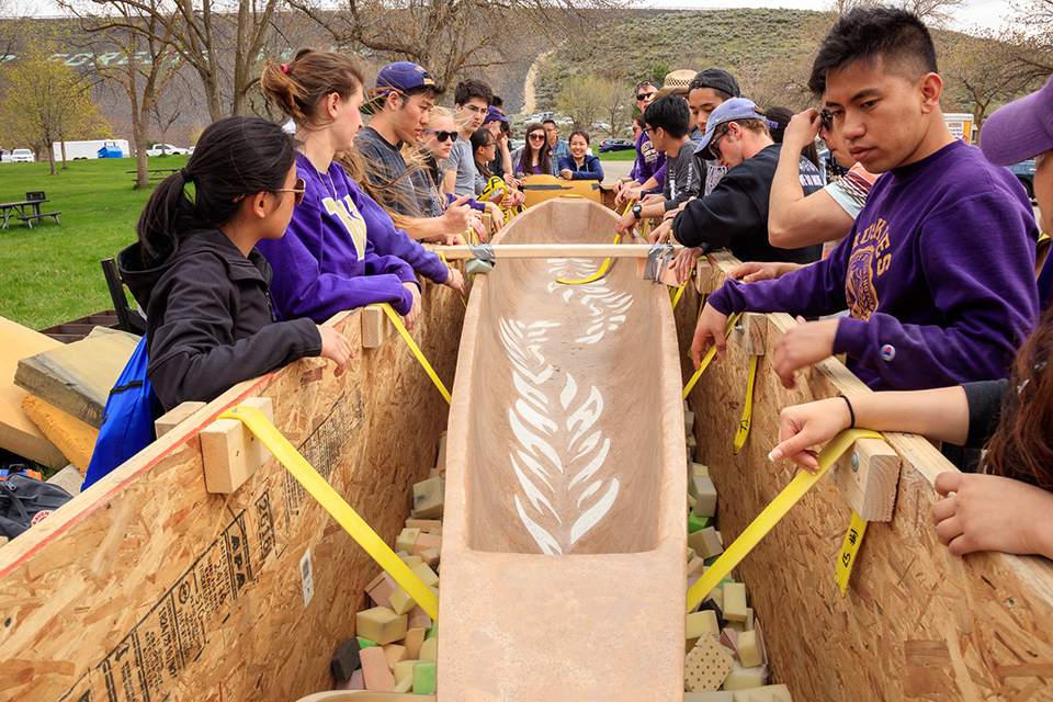 team loading the canoe