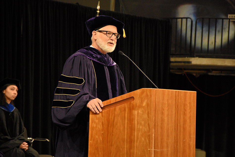 Department Chair Bart Nijssen delivering a speech at a podium.