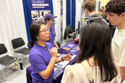 A student engineering ambassador talks to prospective students and families about applying to UW engineering.