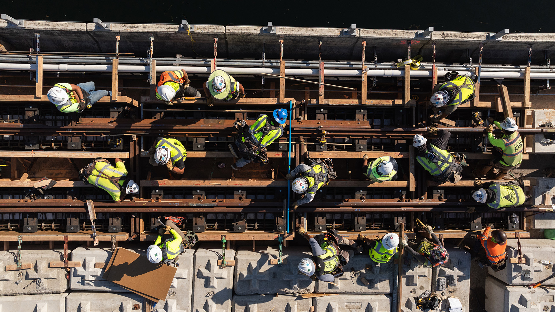 Bird view of Construction workers on a bridge