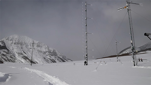 Tower and sensors set up in a mountain basin to measure wind, energy exchange and water vapor.