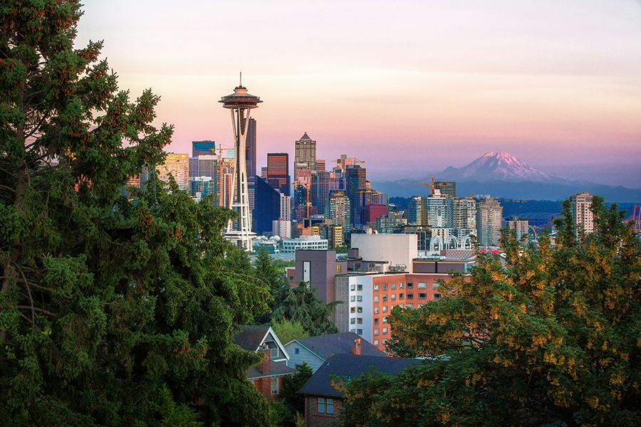 Seattle's skyline at sunset, with the Space Needle in the foreground.
