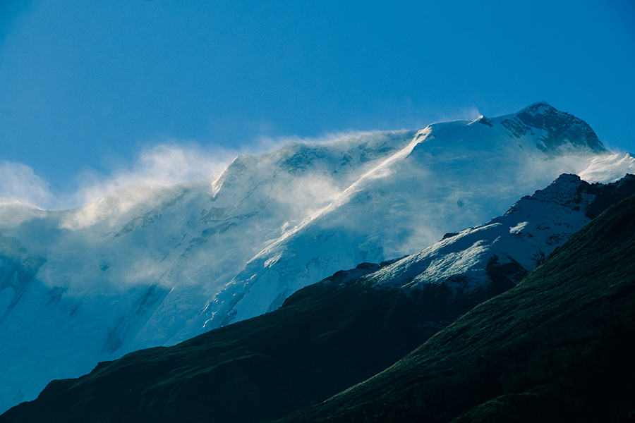 Himalayan mountain peaks covered in glacial ice and snow.