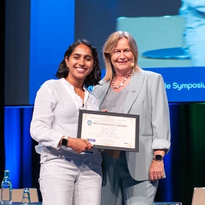 Rubina Singh (left) accepts her award.