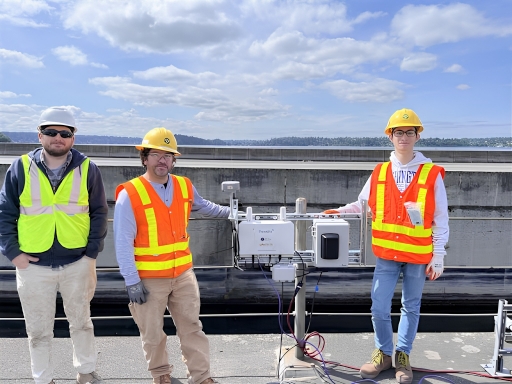 Three engineers, who worked on the light rail extension project, posing for the camera