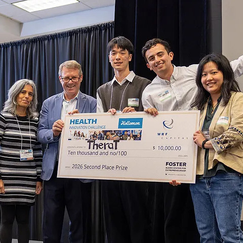 Thera-T team holding their winning check at the Holloman Health Competition.