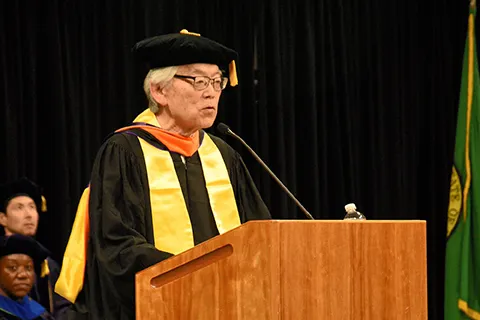 CEE Distinguished Alumni Award recipient Victor Yamada speaks to graduates at the 2024 CEE graduation ceremony