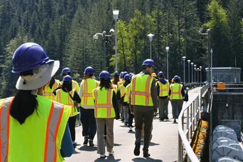 Students walking on top of Cedar Falls dam