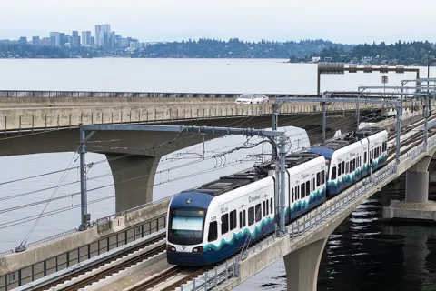 A shot of the light rail on a bridge over Lake Washington.